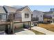 View of the home with raised deck, garage and driveway including parking space at 1805 Kauri Cliffs Dr, Fuquay Varina, NC 27526
