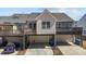 Exterior view of home with raised deck, garage and driveway including parking space at 1805 Kauri Cliffs Dr, Fuquay Varina, NC 27526