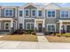 Charming two-story townhome with a landscaped front yard and inviting entrance at 1805 Kauri Cliffs Dr, Fuquay Varina, NC 27526