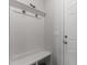 A mudroom with a decorative shelf, hooks, and seating at 1805 Kauri Cliffs Dr, Fuquay Varina, NC 27526