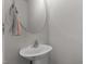 Neutral powder room with modern sink, faucet, mirror, and towel at 1805 Kauri Cliffs Dr, Fuquay Varina, NC 27526