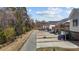 Charming street view of the neighborhood with homes in a wooded setting at 1805 Kauri Cliffs Dr, Fuquay Varina, NC 27526