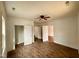 Spacious bedroom featuring wood-look floors and multiple doorways and a ceiling fan at 216 S Tillery St, Rocky Mount, NC 27804