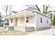 Angle view of exterior showing the porch and gray vinyl siding and showing the roof at 216 S Tillery St, Rocky Mount, NC 27804