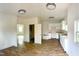 Bright kitchen features white cabinets, wood-look flooring, and ample counter space at 216 S Tillery St, Rocky Mount, NC 27804