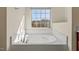 Inviting bathroom featuring a soaking tub and a view of the neighboring homes and trees at 2216 Tanners Mill Dr, Durham, NC 27703