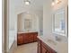Bright main bathroom with dual vanities, a soaking tub, and modern fixtures at 2216 Tanners Mill Dr, Durham, NC 27703