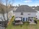 Large backyard with a patio, privacy fence, green space, and mature trees at 2245 Ventana Ln, Raleigh, NC 27604