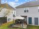 Fenced backyard with a patio, shaded canopy, and green space at 2245 Ventana Ln, Raleigh, NC 27604