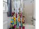 Bright bathroom featuring a tub with a floral shower curtain, a window, and modern fixtures at 2245 Ventana Ln, Raleigh, NC 27604