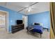 Comfortable bedroom with a bed, dresser, ceiling fan, carpet, and a sunny window at 2245 Ventana Ln, Raleigh, NC 27604