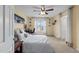 Bright bedroom with ceiling fan, neutral tones, and comfortable furnishings for a peaceful night's sleep at 2245 Ventana Ln, Raleigh, NC 27604