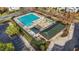 Community pool with a seating area and manicured landscaping at 2245 Ventana Ln, Raleigh, NC 27604