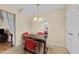 Bright dining area featuring modern light fixture and comfortable seating for Gathering meals at 2245 Ventana Ln, Raleigh, NC 27604
