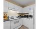 Functional kitchen with white cabinetry, appliances, and countertop space for food preparation at 2245 Ventana Ln, Raleigh, NC 27604