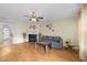 Cozy living room featuring a fireplace, ceiling fan, and ample space for relaxation and entertainment at 2245 Ventana Ln, Raleigh, NC 27604