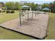 Picturesque playground featuring swings, climbing structures and shady canopies surrounded by manicured lawns at 2245 Ventana Ln, Raleigh, NC 27604