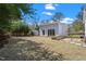 Large backyard with an outbuilding, a shed, and mature trees offering ample space and privacy at 2330 Glascock St, Raleigh, NC 27610
