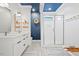 Modern bathroom with double vanity, glass enclosed shower, and stylish blue ceiling at 2330 Glascock St, Raleigh, NC 27610