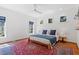 Bright bedroom with hardwood floors, three windows, ceiling fan and natural light at 2330 Glascock St, Raleigh, NC 27610