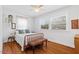 Cozy bedroom with hardwood floors, natural light, and classic furniture at 2330 Glascock St, Raleigh, NC 27610