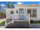 A charming home shows off its inviting front entrance, complete with stylish blue door and modern fixtures at 2330 Glascock St, Raleigh, NC 27610