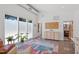 Modern living room with floor-to-ceiling windows and an area rug at 2330 Glascock St, Raleigh, NC 27610
