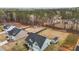 Aerial view showcasing the home with a fenced yard, storage shed, and surrounding trees at 240 Northview Dr, Middlesex, NC 27557