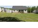 Well-manicured backyard features a storage shed and a view of the lush, surrounding greenery at 240 Northview Dr, Middlesex, NC 27557