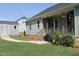 A backyard featuring a porch, a shed, a well-maintained lawn, and a winding walkway at 240 Northview Dr, Middlesex, NC 27557