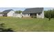 Well-manicured backyard features a storage shed and a view of the lush, surrounding greenery at 240 Northview Dr, Middlesex, NC 27557