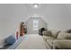 Bonus room with natural light, carpeted floors, and comfortable couch, perfect for an office at 240 Northview Dr, Middlesex, NC 27557