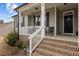 Inviting front porch with seating, string lights, and charming decor at 240 Northview Dr, Middlesex, NC 27557