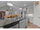Kitchen island features granite countertops, stainless appliances, and an open floor plan at 240 Northview Dr, Middlesex, NC 27557