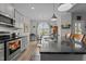 Modern kitchen boasts granite countertops, sleek appliances, and abundant natural light at 240 Northview Dr, Middlesex, NC 27557