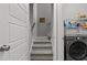Convenient laundry area featuring a modern washer and dryer, located near the staircase at 240 Northview Dr, Middlesex, NC 27557