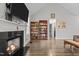 Inviting living room enhanced by a fireplace, rich wood flooring, and built-in bookshelves at 240 Northview Dr, Middlesex, NC 27557