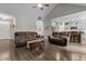 Open-concept living room with a fireplace, modern flooring, and stylish, neutral decor at 240 Northview Dr, Middlesex, NC 27557