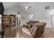 Open-concept living room with luxury flooring, a ceiling fan, and elegant furniture at 240 Northview Dr, Middlesex, NC 27557