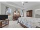 Spacious main bedroom with a trey ceiling, large windows, and a full furniture set at 240 Northview Dr, Middlesex, NC 27557