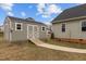 The storage shed features white trim and a ramp with a walkway to the house at 240 Northview Dr, Middlesex, NC 27557