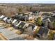 Scenic aerial view of a community with single-Gathering homes, apartment buildings, and a playground at 2613 Lilymount Dr, Raleigh, NC 27610