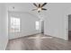 Bright bedroom featuring neutral walls, natural light, and updated floors at 2613 Lilymount Dr, Raleigh, NC 27610
