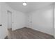 Bedroom featuring neutral walls and updated flooring at 2613 Lilymount Dr, Raleigh, NC 27610