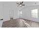 Bedroom with updated flooring, neutral walls, natural light, and ceiling fan at 2613 Lilymount Dr, Raleigh, NC 27610