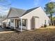 Attractive home exterior showcasing vinyl siding, a front porch and manicured lawn at 2613 Lilymount Dr, Raleigh, NC 27610