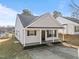 A well maintained single story home featuring black shutters and a welcoming front porch at 2613 Lilymount Dr, Raleigh, NC 27610