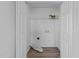 Open laundry room with washer and dryer hookups, closet, and wire shelving at 2613 Lilymount Dr, Raleigh, NC 27610