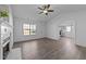 Bright living room with wood floors, vaulted ceiling, and a charming fireplace at 2613 Lilymount Dr, Raleigh, NC 27610