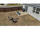 Aerial view of the backyard featuring a patio with a grill, outdoor seating, and a fire pit at 2914 Lake James Dr, Fuquay Varina, NC 27526